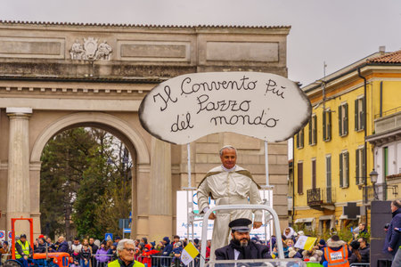 Crema, Italy - February 26, 2023: Carnival parade, with dancers in costumes, and crowd, in Crema, Lombardy, Northern Italyのeditorial素材