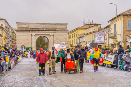 Crema, Italy - February 26, 2023: Carnival parade, with dancers in costumes, and crowd, in Crema, Lombardy, Northern Italyのeditorial素材