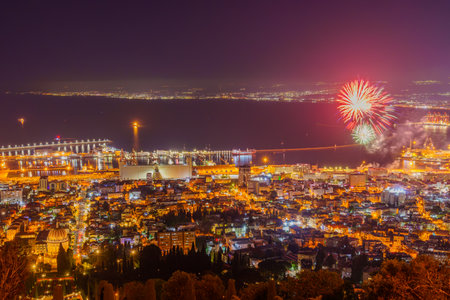 View of Israel 75th Independence Day fireworks, with the Bahai shrine and gardens, downtown and the harbor, in Haifa, Northern Israelの写真素材