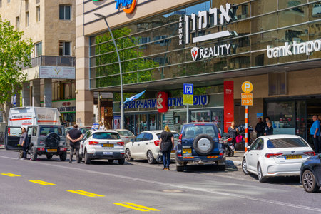 Haifa, Israel - April 25, 2023: Street scene with people and traffic standing still for the sound of siren, on the national annual Memorial Day (war and terror casualties), in Haifa, Israelのeditorial素材