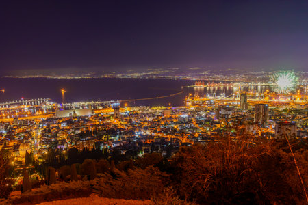 View of Israel 75th Independence Day fireworks, with the Bahai shrine and gardens, downtown and the harbor, in Haifa, Northern Israelの写真素材