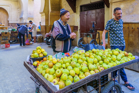 Fes, Morocco - March 31, 2023: Street scene near the Semmarin Medina Gate, with locals and visitors, in Fes, Moroccoのeditorial素材