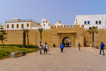 Essaouira, Morocco - April 07, 2023: View of the walls of the medina, with locals and visitors, in Essaouira (Mogador), Moroccoのeditorial素材