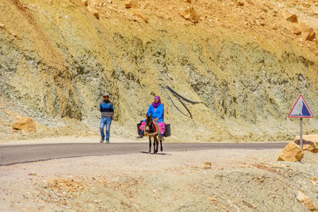 Ait Benhaddou, Morocco - April 04, 2023: View of locals walking and riding a donkey, in the High Atlas Mountains, Moroccoのeditorial素材