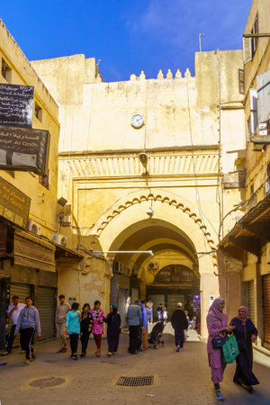 Fes, Morocco - March 31, 2023: Street scene near the Semmarin Medina Gate, with locals and visitors, in Fes, Moroccoのeditorial素材