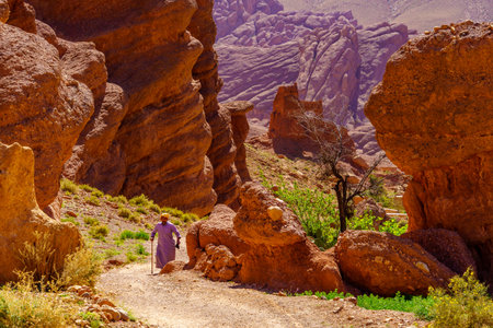 Ait Ouglif, Morocco - April 03, 2023: View of various rock formation, with a local, in the Dades Gorge, the High Atlas Mountains, Central Moroccoのeditorial素材