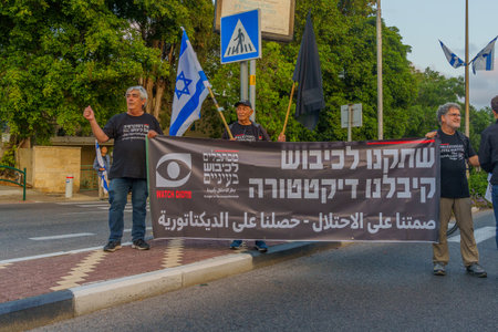 Haifa, Israel - May 13, 2023: Men with anti-occupation sign. 19th week of anti-government protest in Haifa, Israelのeditorial素材