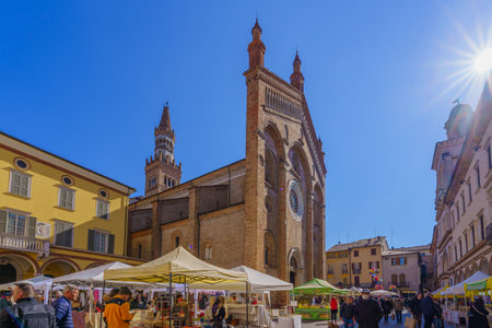 Crema, Italy - February 26 2023: Carnival market scene in the Cathedral (Duomo) square, with locals and visitors, in Crema, Lombardy, Northern Italyのeditorial素材
