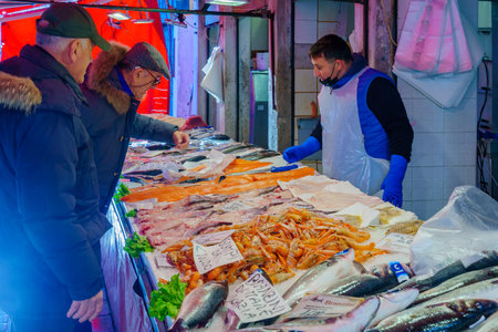 Venice, Italy - March 02, 2022: Scene of the Rialto market, with seafood on sale, sellers, and shoppers, in Venice, Veneto, Northern Italyのeditorial素材