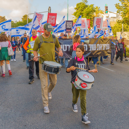 Haifa, Israel - May 20, 2023: People marching with flags and various signs. 20th week of anti-government protest in Haifa, Israelのeditorial素材