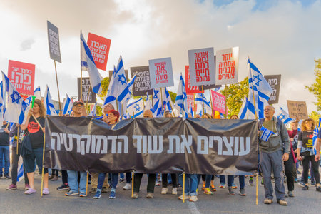 Haifa, Israel - May 20, 2023: People marching with flags and various signs. 20th week of anti-government protest in Haifa, Israelのeditorial素材