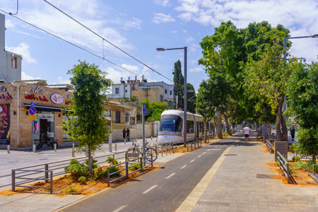 Tel-Aviv, Israel - May 21, 2023: View of the Jerusalem Boulevard, with light rail, locals, and visitors, in Jaffa, now part of Tel-Aviv-Yafo, Israelのeditorial素材