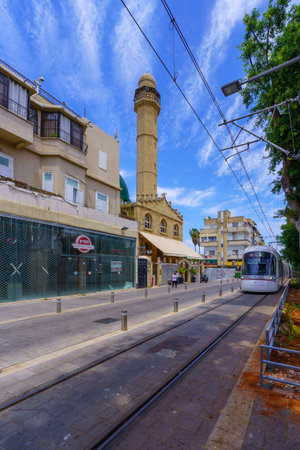 Tel-Aviv, Israel - May 21, 2023: View of the Al-Nuzha Mosque, with the light rail, locals, and visitors, in Jerusalem Boulevard, Jaffa, now part of Tel-Aviv-Yafo, Israelのeditorial素材