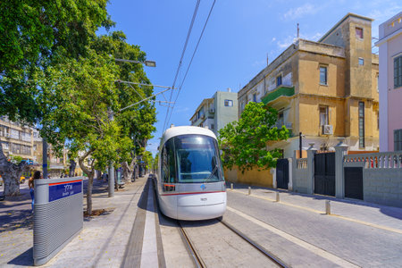 Tel-Aviv, Israel - May 21, 2023: View of the Jerusalem Boulevard, with light rail, locals, and visitors, in Jaffa, now part of Tel-Aviv-Yafo, Israelのeditorial素材