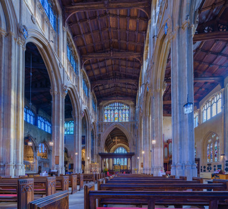Cirencester, UK - October 17, 2022: View of the interior of the Church of St. John the Baptist, and its stained-glass windows, in Cirencester, the Cotswolds region, England, UKのeditorial素材