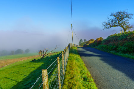 View of a foggy morning landscape, in Snowdonia National Park, the North of Wales, UKの写真素材