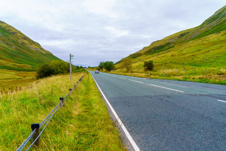 View of a mountain road in the Lake District, Cumbria, England, UKの写真素材