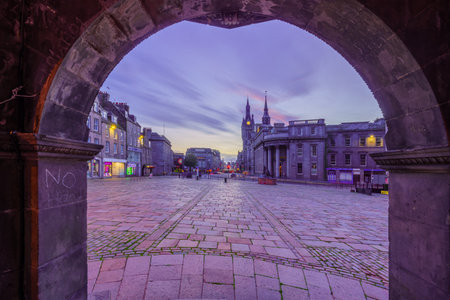 Aberdeen, UK - October 06, 2022: Sunset view of Castle Street in central Aberdeen, with locals and visitors. Scotland, UKのeditorial素材