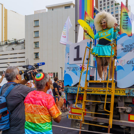 Tel-Aviv, Israel - June 08, 2023: View of crowd and dancers on a truck, part of the annual Pride Parade of the LGBTQ+ community, in Tel-Aviv, Israelのeditorial素材