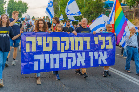 Haifa, Israel - June 10, 2023: People marching with flags and various signs. 23rd week of anti-government protest in Haifa, Israelのeditorial素材