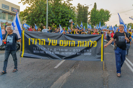 Haifa, Israel - June 10, 2023: People perform anti dictatorship display. 23rd week of anti-government protest in Haifa, Israelのeditorial素材