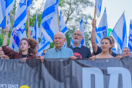 Haifa, Israel - June 10, 2023: People marching with flags and various signs (with Nobel prize winner Prof. Hershko). 23rd week of anti-government protest in Haifa, Israelのeditorial素材