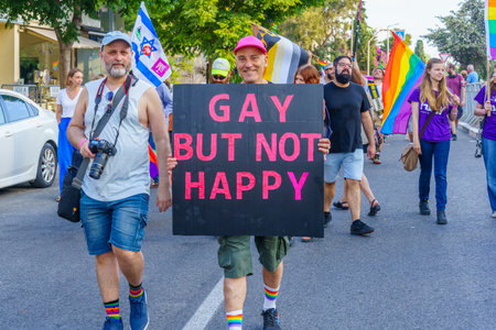 Haifa, Israel - June 15, 2023: View of participants marching with various signs, in the annual Pride Parade of the LGBTQ+ community, in Haifa, Israelのeditorial素材