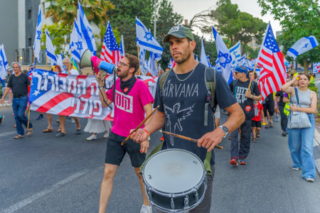 Haifa, Israel - June 17, 2023: People marching with flags and various signs. Week 24 of anti-government protest in Haifa, Israelのeditorial素材