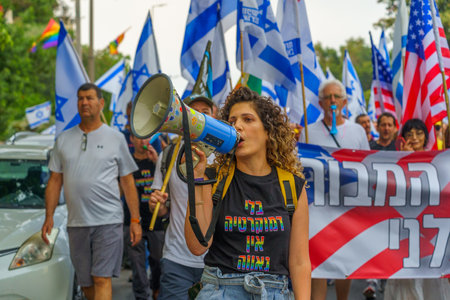 Haifa, Israel - June 17, 2023: People marching with flags and various signs. Week 24 of anti-government protest in Haifa, Israelのeditorial素材