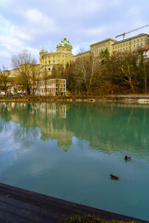 View of the Aare River and the Parliament Building (Bundeshaus), in Bern, Switzerlandのeditorial素材