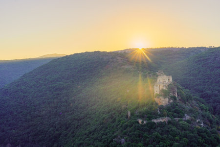 View of the sun rises over the Crusader Montfort Castle and the Kziv stream valley, in the Upper Galilee, Northern Israelのeditorial素材