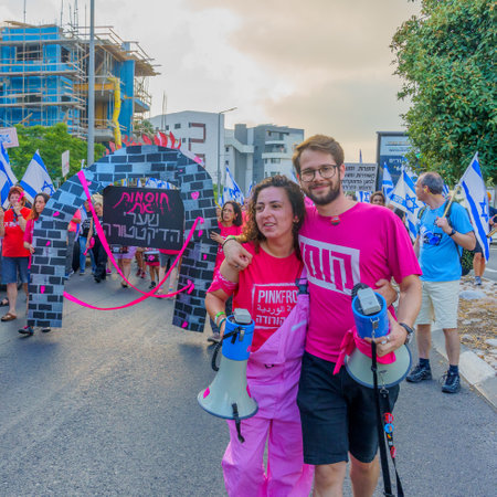 Haifa, Israel - July 01, 2023: People marching with flags and various signs. Week 26 of anti-government protest in Haifa, Israelのeditorial素材
