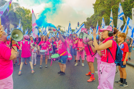 Haifa, Israel - July 01, 2023: People marching with drums, flags, and various signs. Week 26 of anti-government protest in Haifa, Israelのeditorial素材