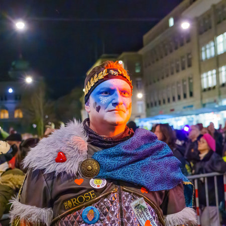 Bern, Switzerland - February 23, 2023: A man in costumes in the street, part of the carnival of Bern, Switzerlandのeditorial素材
