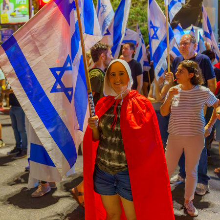 Haifa, Israel - July 05, 2023: People protesting with flags, and various signs, in response to...