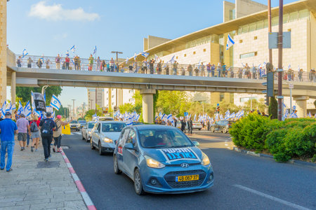 Haifa, Israel - July 11, 2023: People protest with flags and various signs. Part of day of disruption against controversial judicial overhaul, in Haifa, Israelのeditorial素材