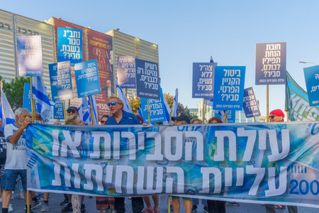 Haifa, Israel - July 15, 2023: People march with flags and various signs. Part of week 28 of protest against controversial judicial overhaul. Haifa, Israelのeditorial素材