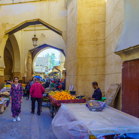 Fes, Morocco - March 31, 2023: Street scene near the Semmarin Medina Gate, with locals and visitors,...
