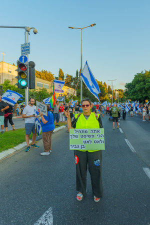 Haifa, Israel - August 05, 2023: People march with various flags and signs, slogan: We shall not give up on a better future. Week 31 of protest against controversial judicial overhaul. Haifa, Israelのeditorial素材