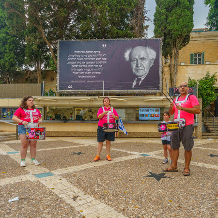 Haifa, Israel - August 12, 2023: Group of drummers take part in protest, quotation of Ben Guryon in the background. Part of week 32 of protest against controversial judicial overhaul. Haifa, Israelのeditorial素材