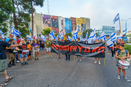 Haifa, Israel - August 12, 2023: People march with various flags and signs. Week 32 of protest against controversial judicial overhaul. Haifa, Israelのeditorial素材