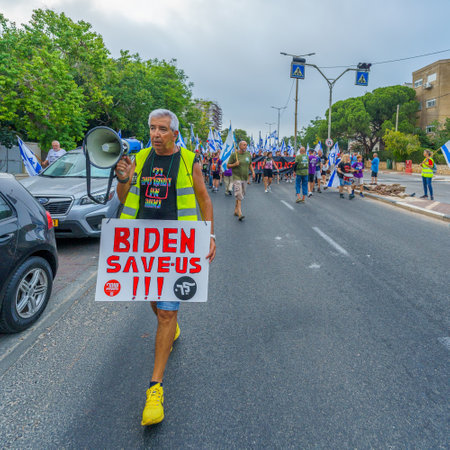 Haifa, Israel - August 12, 2023: People march with various flags and signs. Week 32 of protest against controversial judicial overhaul. Haifa, Israelのeditorial素材
