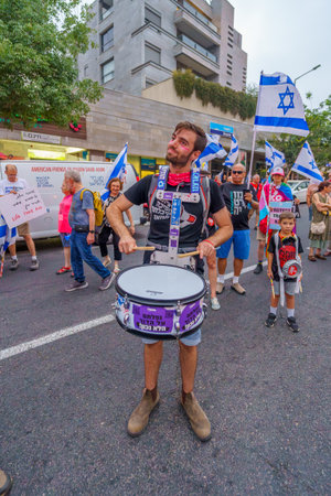 Haifa, Israel - August 12, 2023: Group of young drummers take part in protest. Part of week 32 of protest against controversial judicial overhaul. Haifa, Israelのeditorial素材
