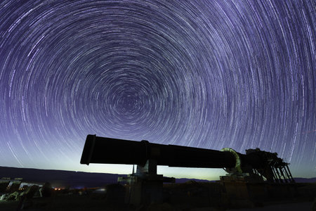 View of star trails and perseid meteors, over an old quarry oven, in Makhtesh (crater) Ramon, the...