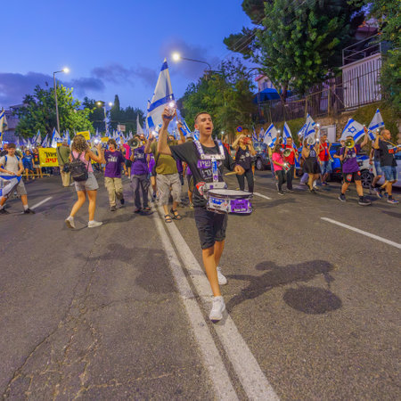 Haifa, Israel - September 02, 2023: People march with various signs and flags. Week 35 of protest against controversial judicial overhaul. Haifa, Israelのeditorial素材