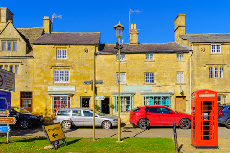 Chipping Campden, UK - October 18, 2022: Street view, with various building, red phone box, locals, and visitors, in Chipping Campden, the Cotswolds region, England, UKのeditorial素材