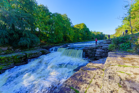 Aysgarth, UK - September 23, 2022: View of the Aysgarth Falls, with visitors, in Yorkshire Dales National Park, North Yorkshire, England, UKのeditorial素材