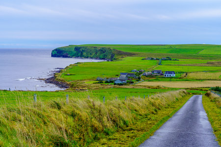 View of countryside and coast in the island of South Ronaldsay, Orkney Islands, Scotland, UKの写真素材
