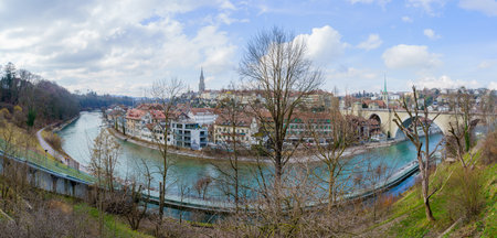 Bern, Switzerland - February 23, 2023: Panoramic view of the Aare River and Old City skyline, in...