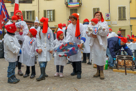 Ivrea, Italy - February 19, 2023: Participant are celebrating, part of the historical carnival of Ivrea, Piedmont, Northern Italyのeditorial素材